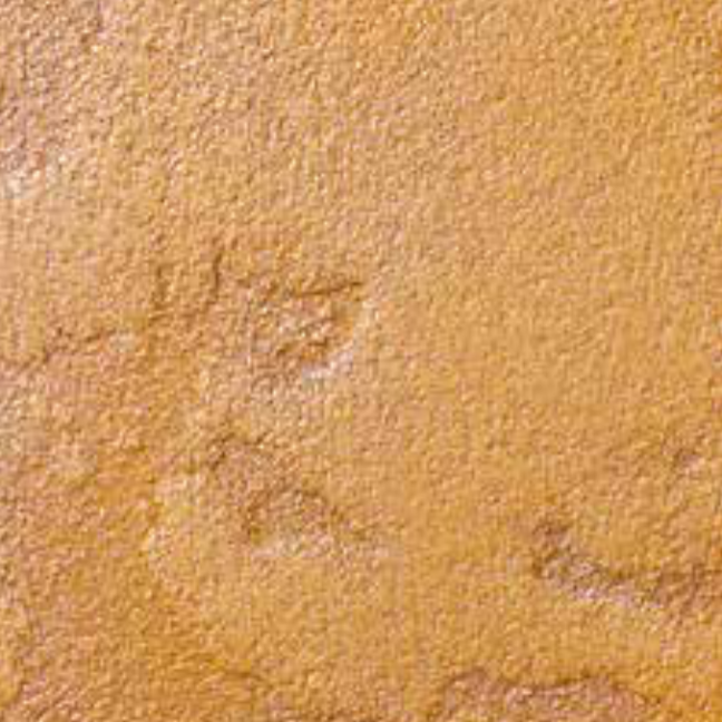 Rostfarbene Metalleffektlasur auf geflecktem Feinputz